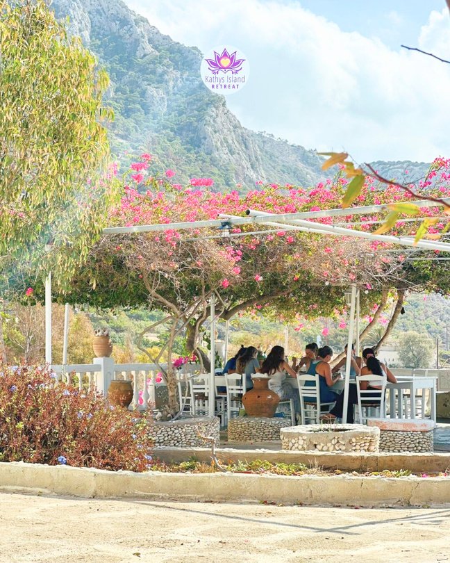 Dining beneath bougainvillea at the retreat