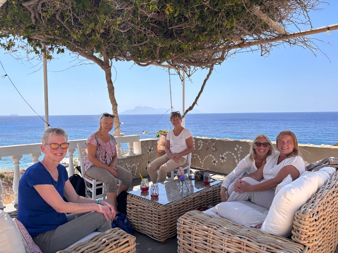 Retreat guests relaxing beside the sea
